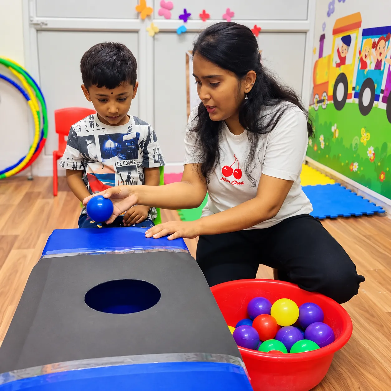 A therapist working through early learning activities with a child.